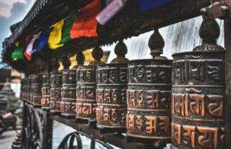 India tour_Nepal_ Kathmandu_ Swayambhunath Stupa Stone Art Intricate stone art and carvings at Swayambhunath Stupa in Kathmandu, Nepal, showcasing traditional Buddhist craftsmanship.